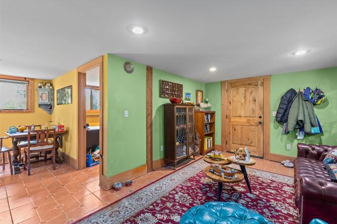Casita dining nook and living area with hand-painted tile floors and wood details