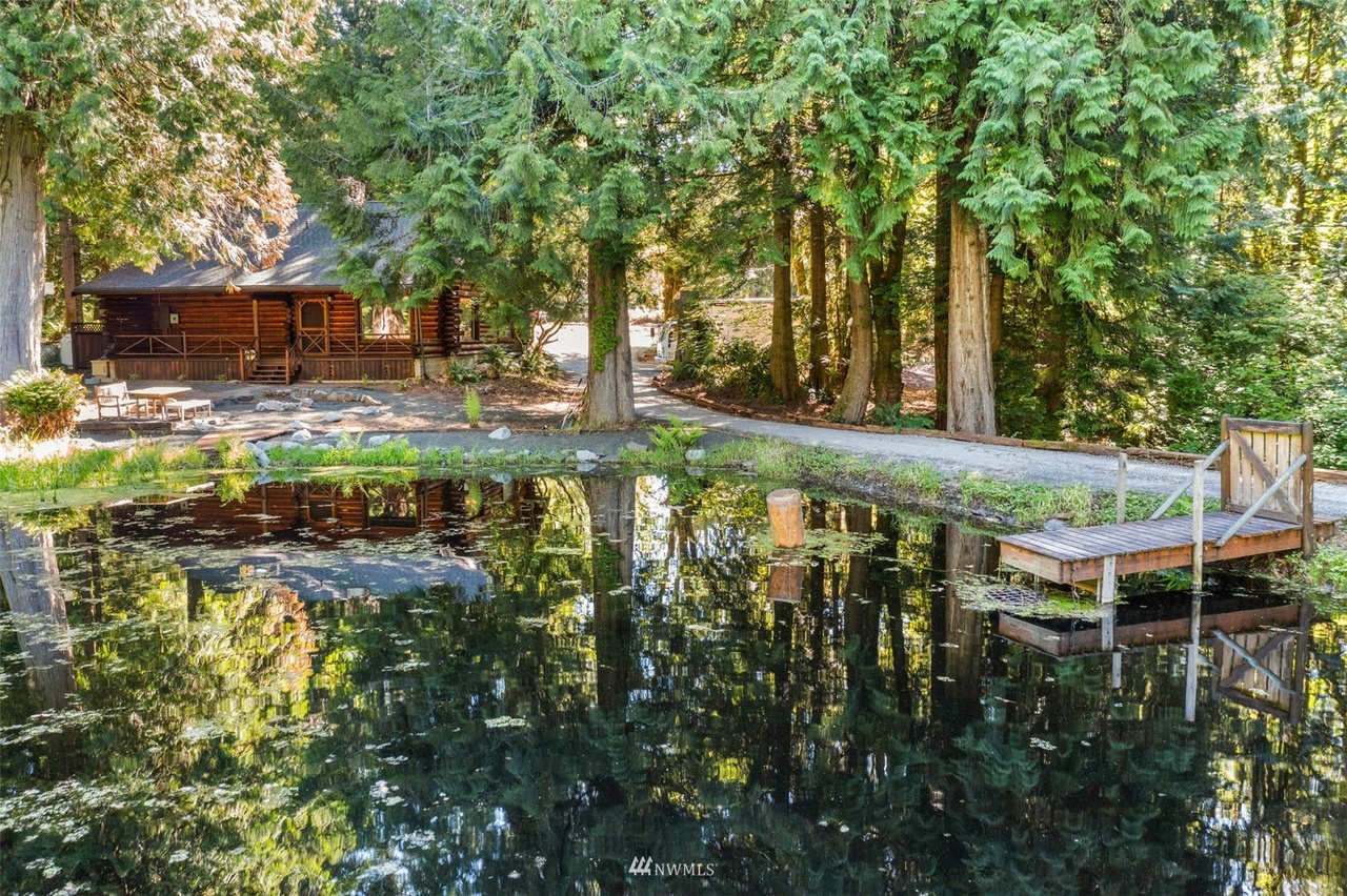 Aerial view of the woodland casita retreat reflecting on a private pond