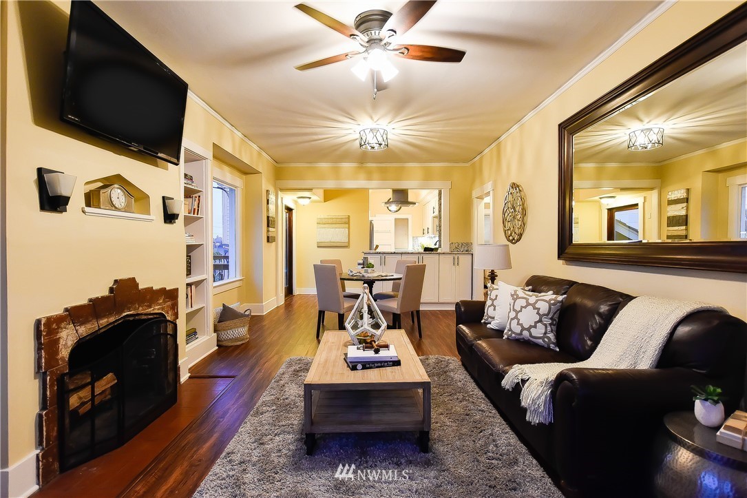 Open living and dining area with hardwood floors and leather seating