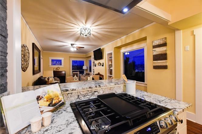 View from the kitchen across the granite island to the living area