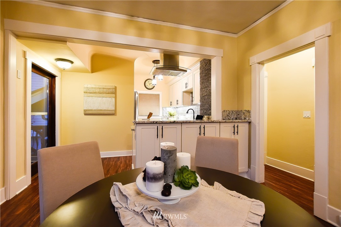 Dining space framed by original craftsman trim and cased openings
